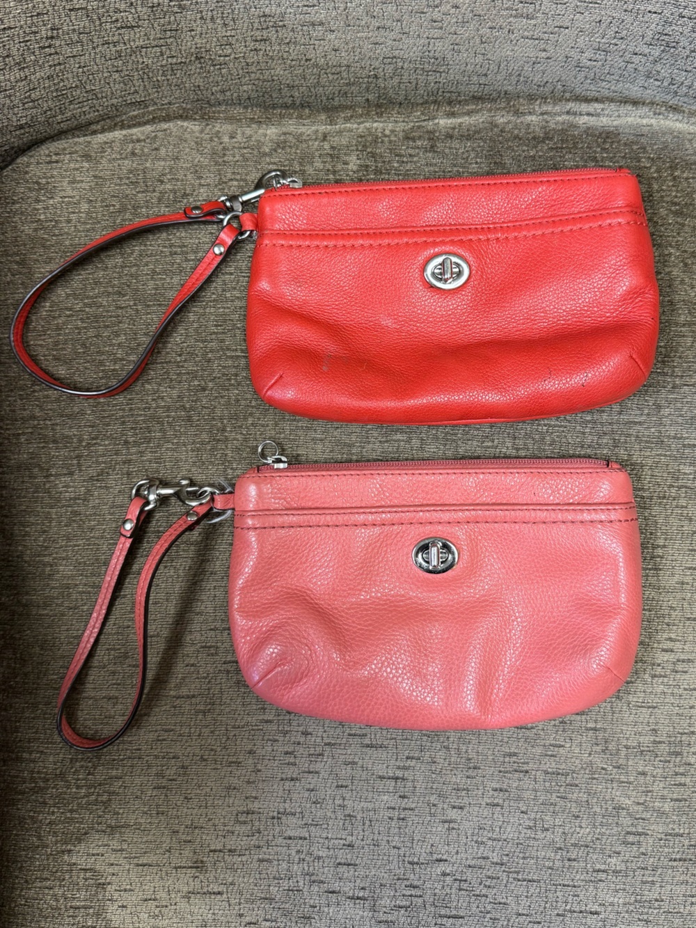 2 Coach Leather Wristlet Clutches, 1 Coral w/ Beige Satin & 1 Red w/ Red Satin.